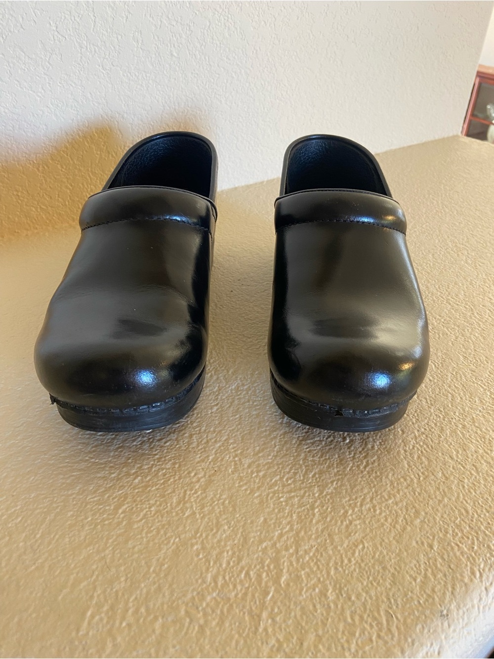 Dansko woman’s Black Slip-On Clogs